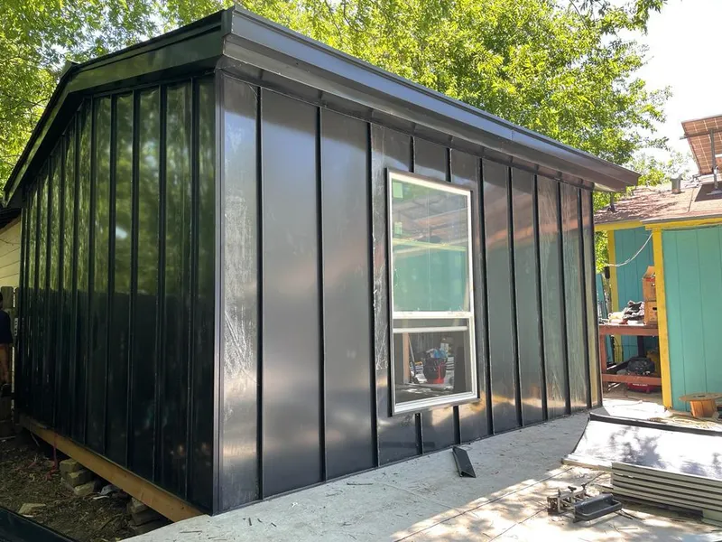 Black standing seam metal wall panels for Metal Roof Installation in Williston